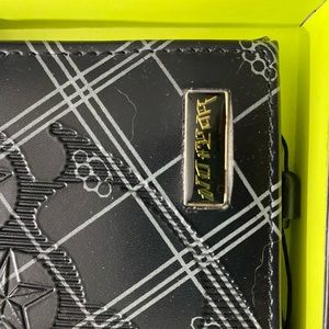 No Fear genuine leather.  Never used.   Still in box